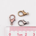 Sada bižuterních zapínání bez Niklu - delfín 10x6mm 240ks